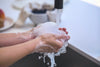 hands washing with soapy suds