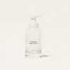 A clear Hand Soap Forever Bottle with a sleek white pump, labeled Blueland and Foaming Hand Soap, sits elegantly against a plain white background.